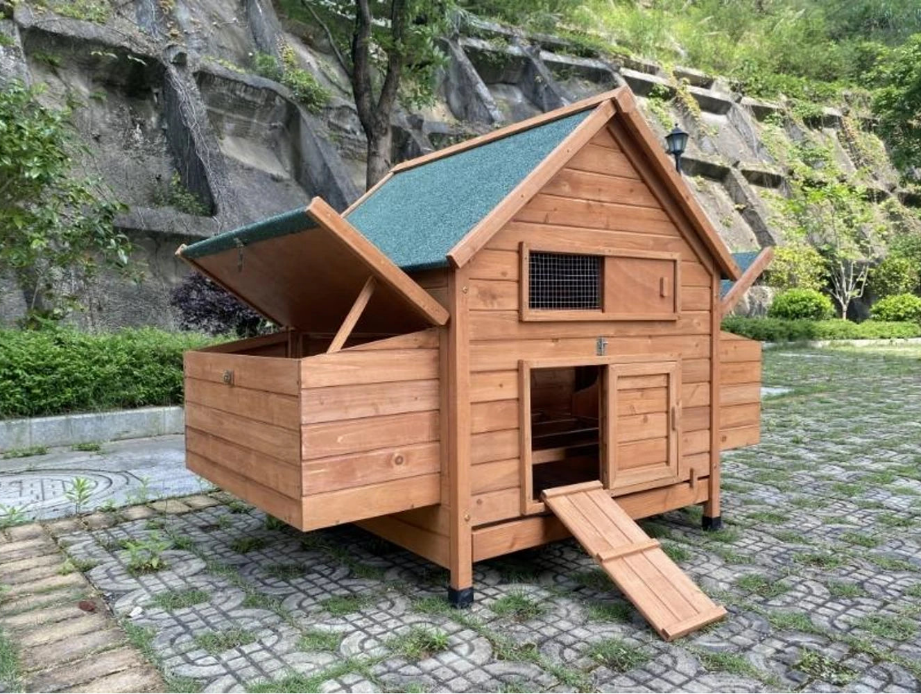 Chicken coop for sale, with built-in nesting boxes and asphalt roof.