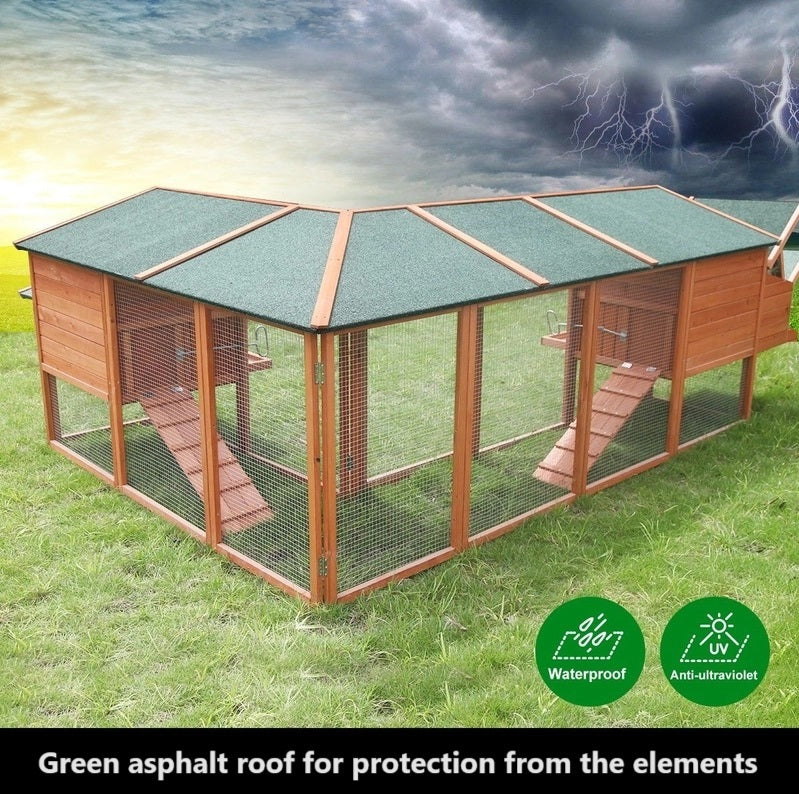 L shaped chicken coop with green asphalt roof for weather protection.