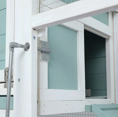 Entrance to upper level, showing sliding door to coop.