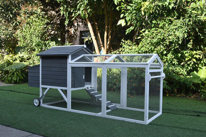 Chicken coop with wheels, featuring a grey and white design.