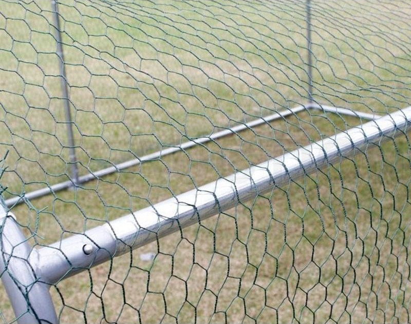 Close-up of the wire mesh securely attached to the frame of the 4x3m chicken run, offering protection and durability for backyard chooks.